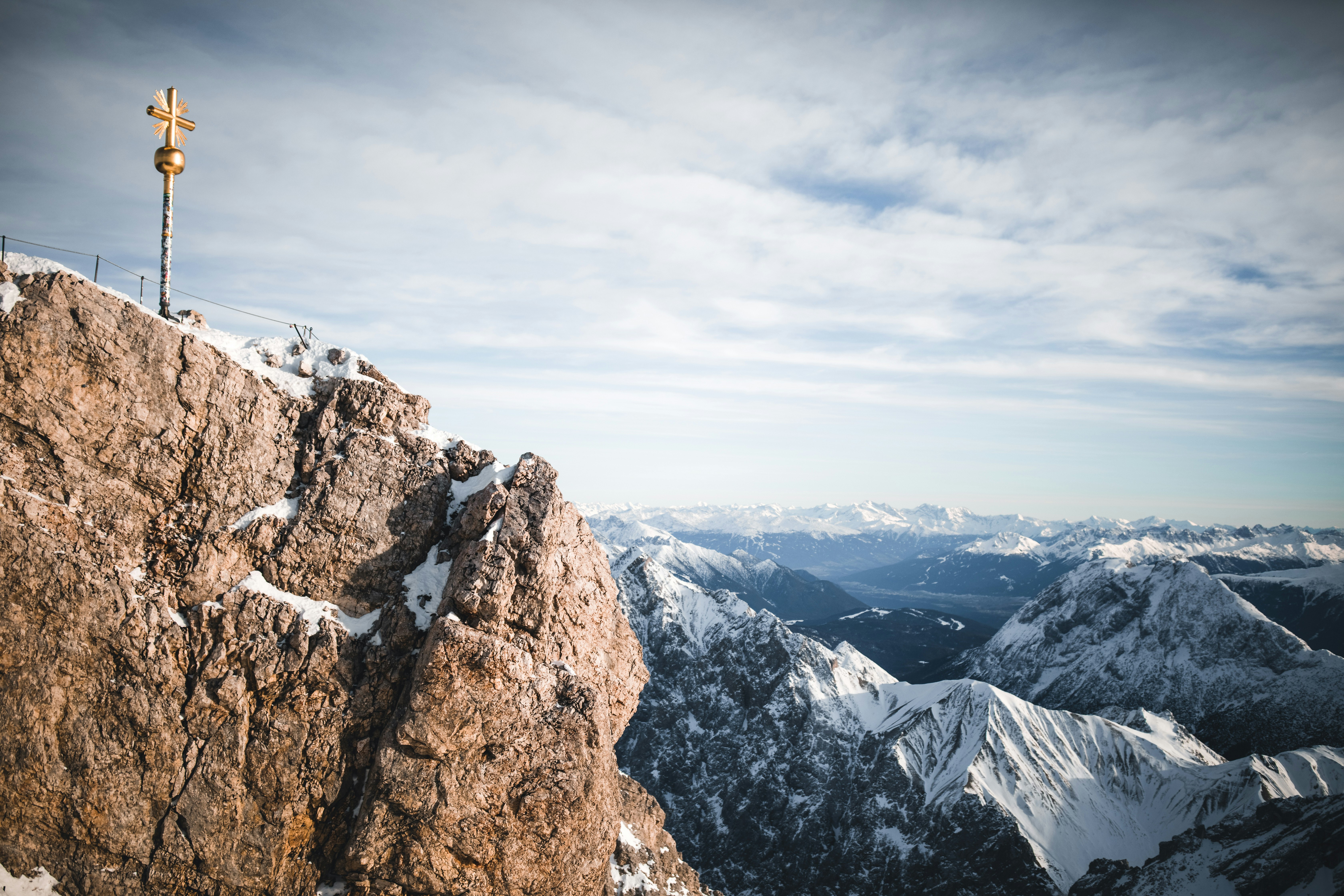 brown rocky mountain under white cloudy sky during daytime